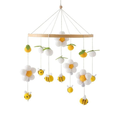 Mobile bébé fleurs blanches, abeilles jaunes et feuilles décoratives.